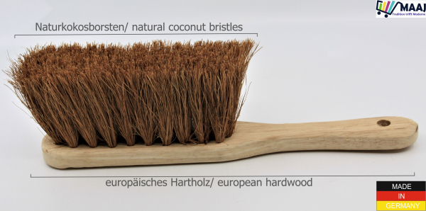 Hand brush with coconut placement